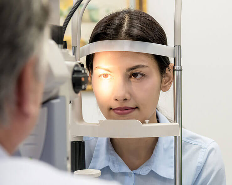 Woman getting eye exam