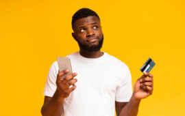 Man with credit card and phone