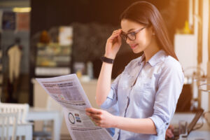 woman reading the newspaper