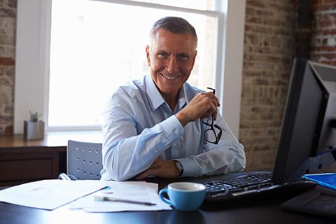 Older smiling man with glasses