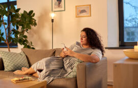 Woman on phone on couch